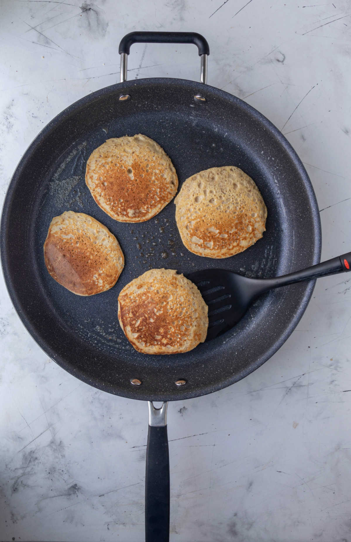 Cooking pancakes in a skillet. 