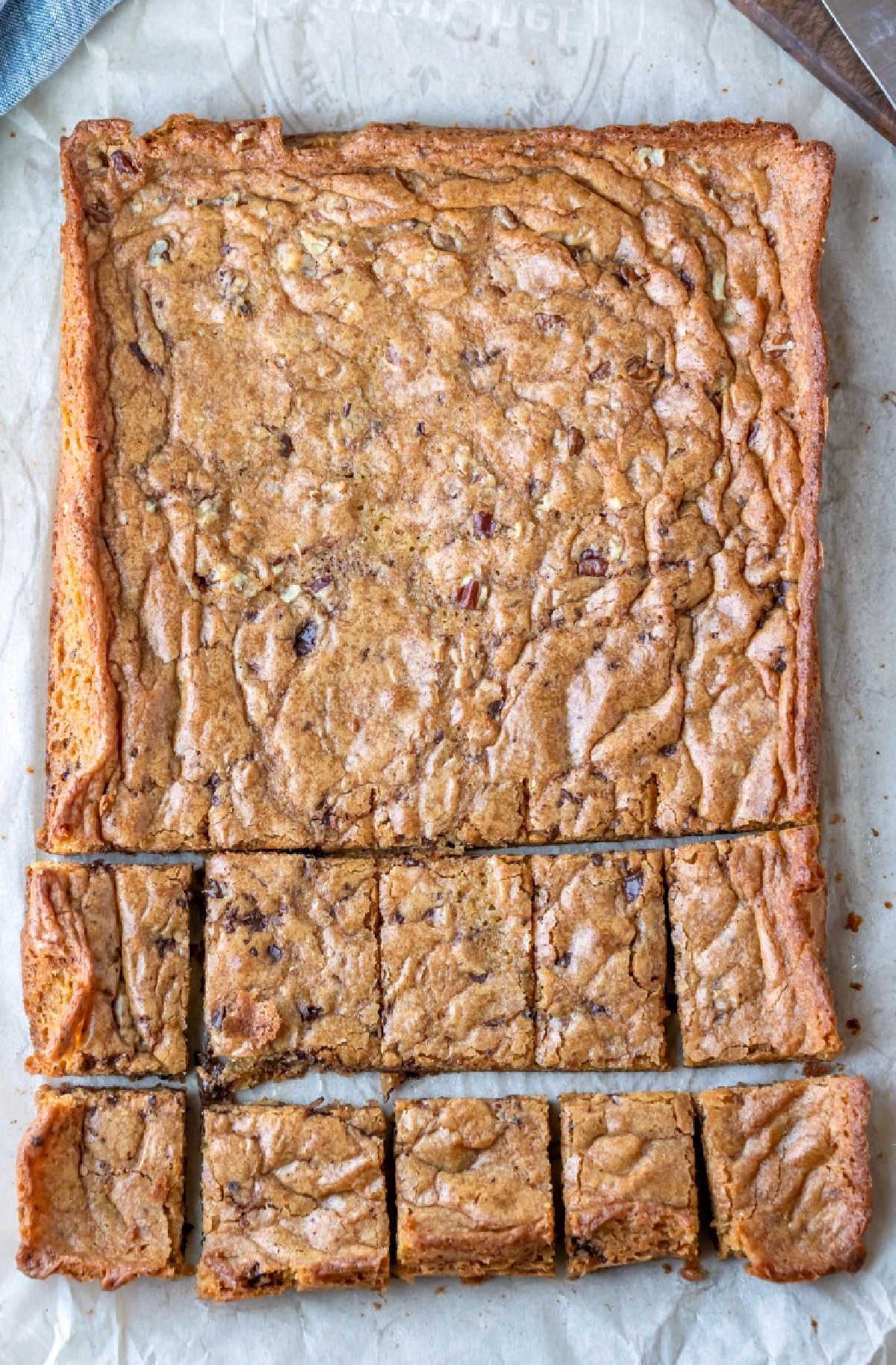 Pan of blondies on parchment paper.