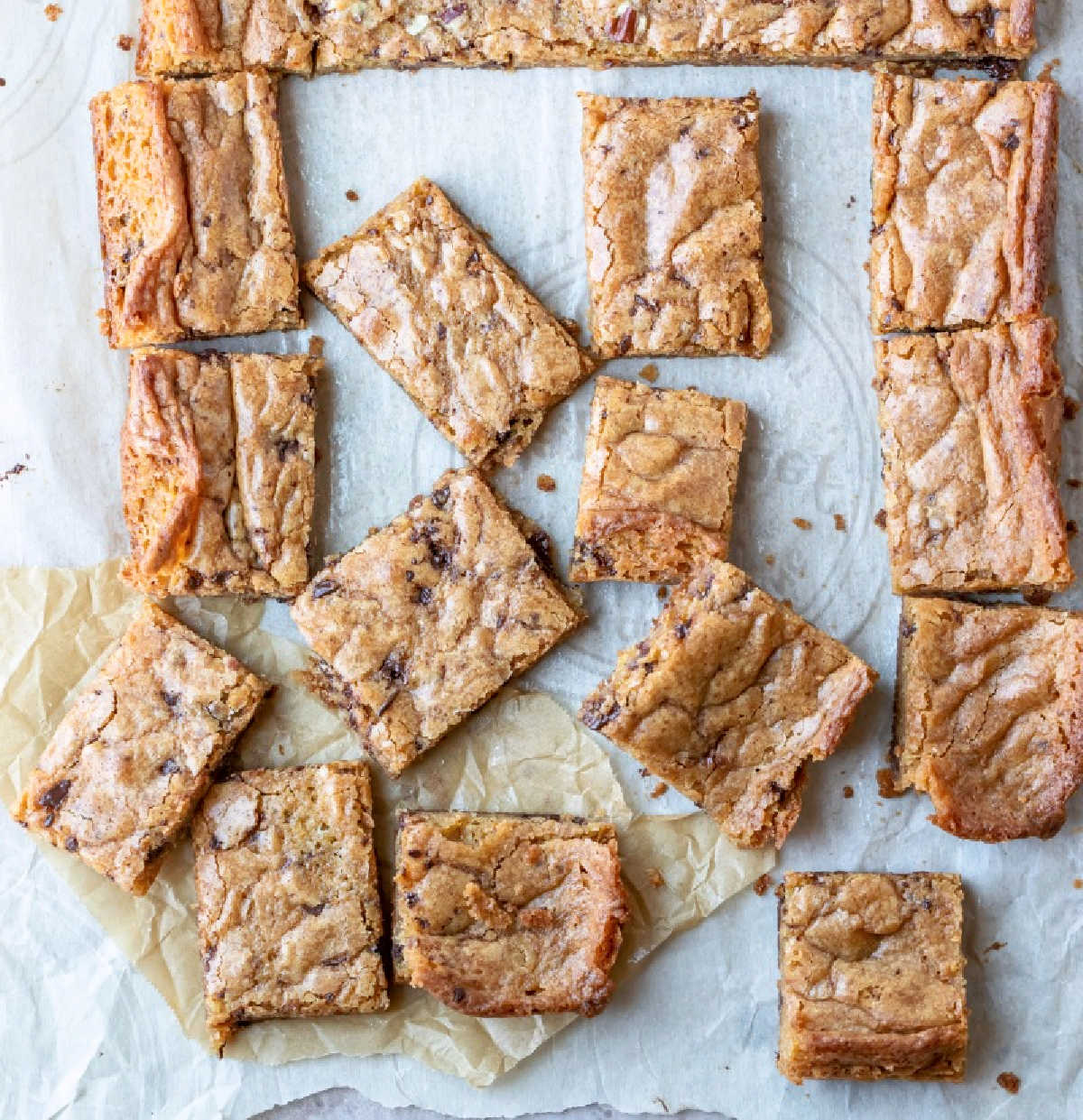 Cut up blondies on a piece of parchment paper.