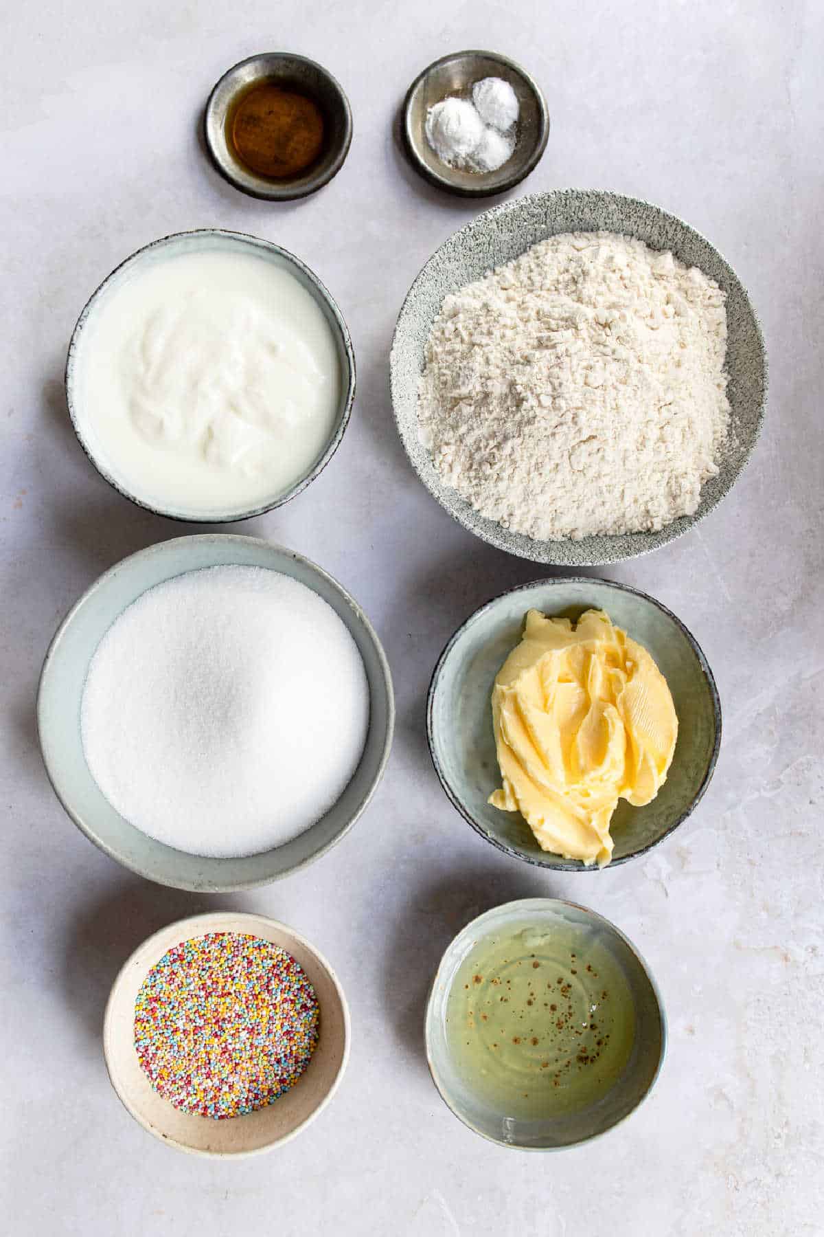 Ingredients for homemade funfetti cake in dishes.