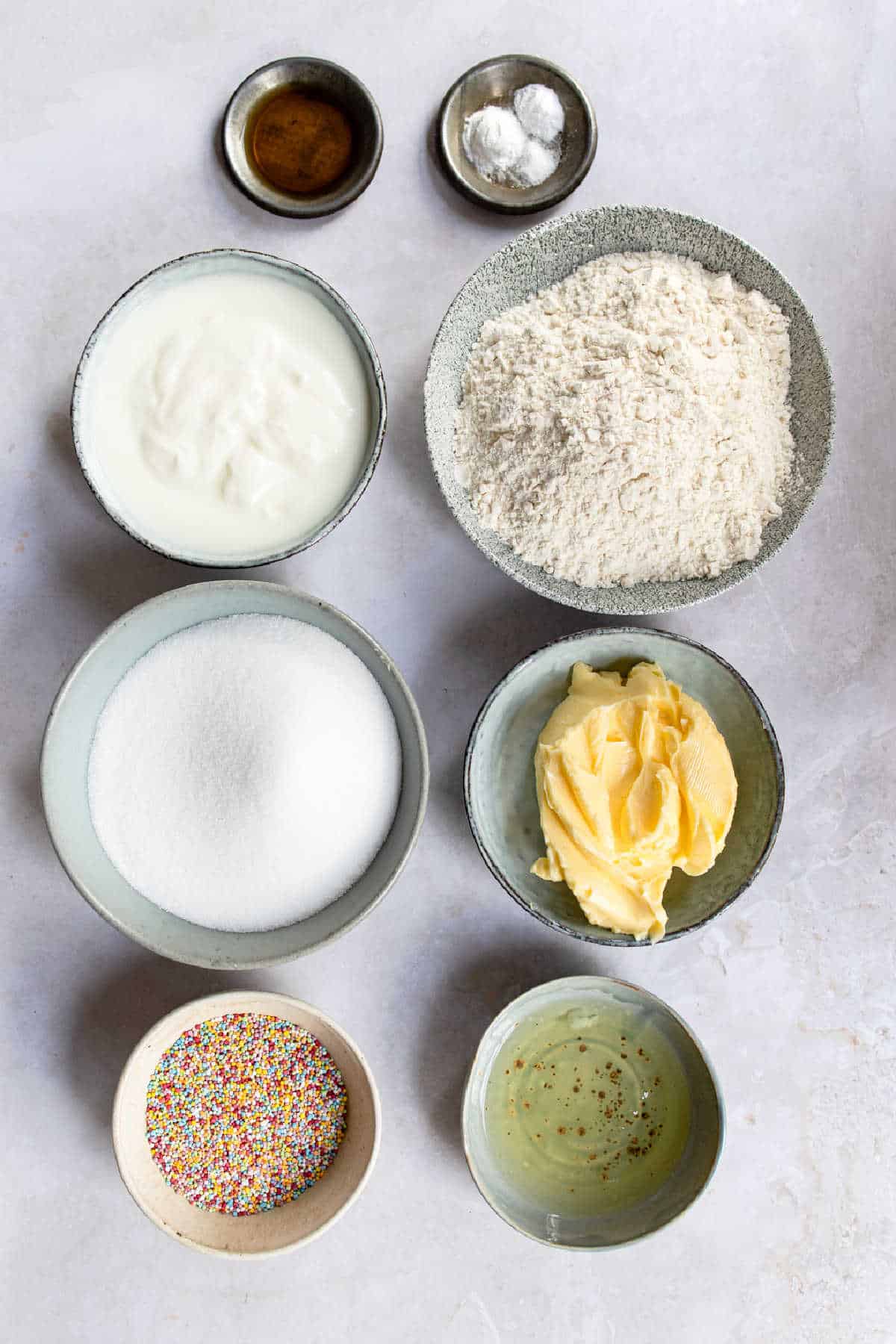 Ingredients for homemade funfetti cake in dishes. 