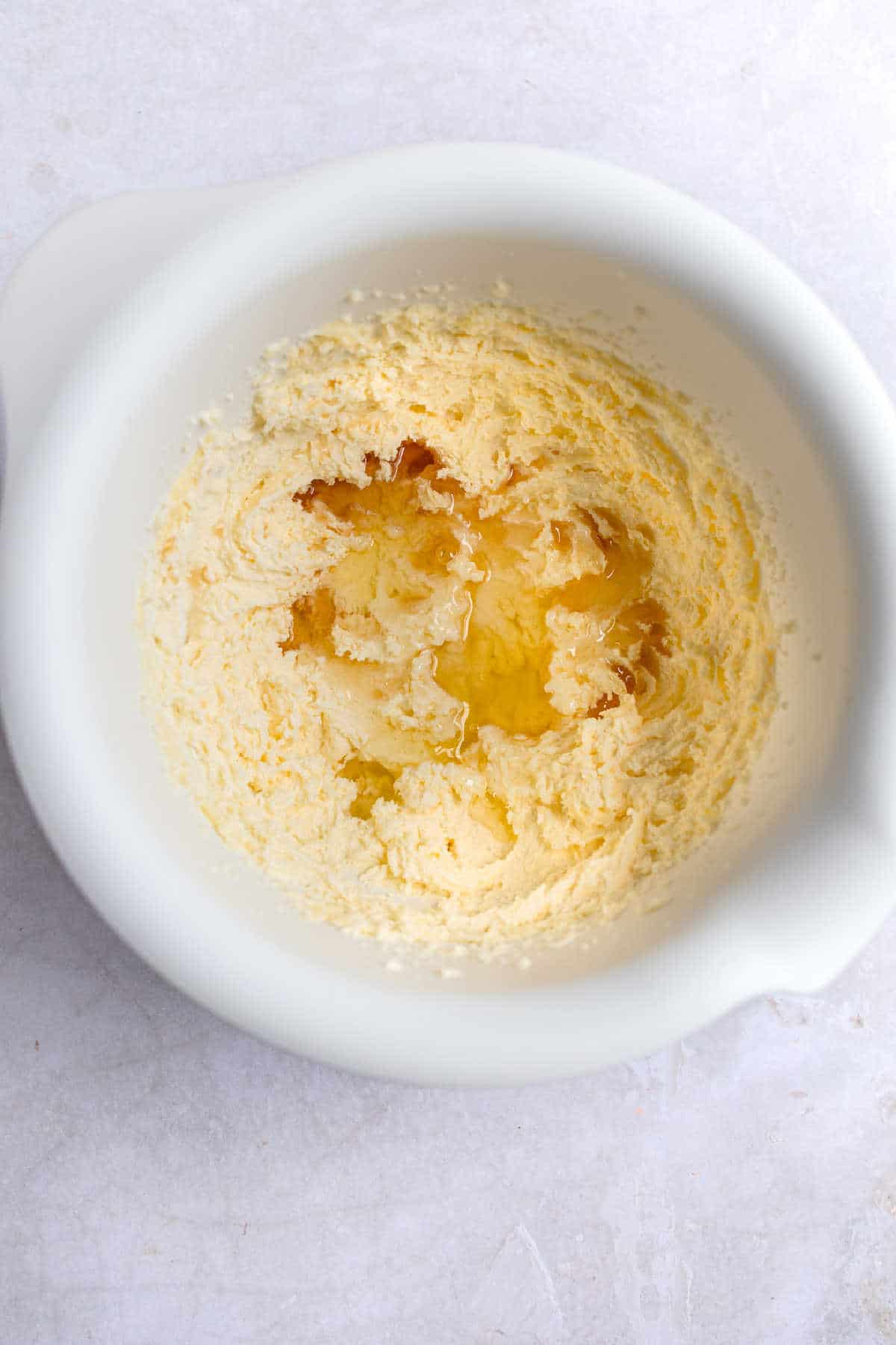 Egg whites in creamed butter and sugar.