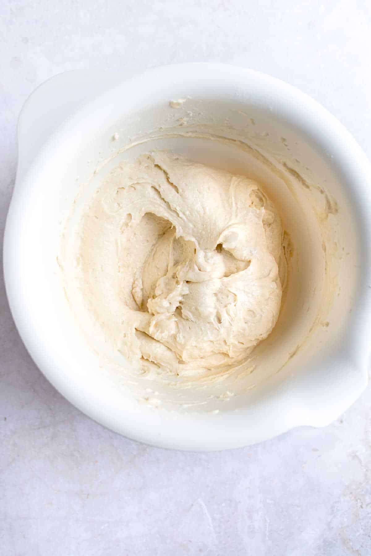 Funfetti cake batter in a white mixing bowl. 