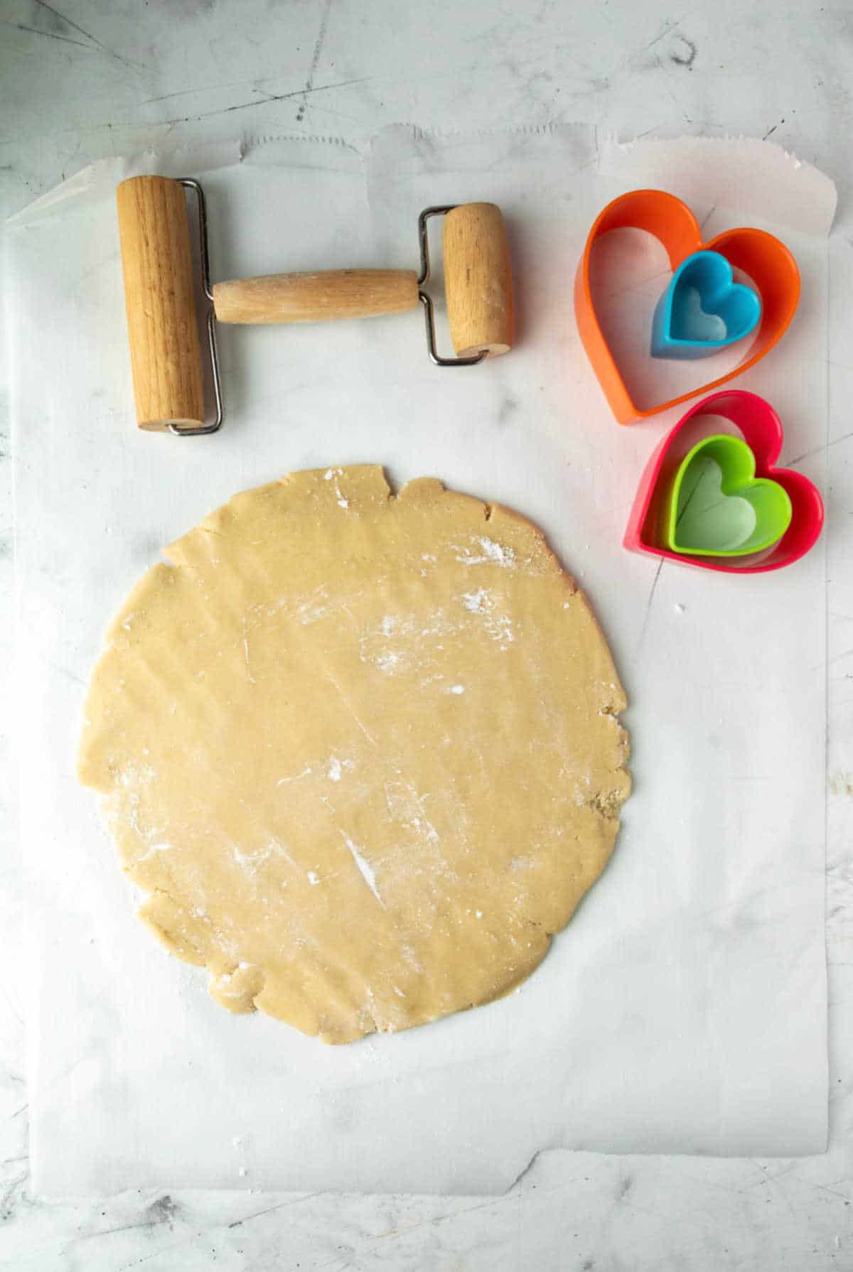 Sugar cookie dough on a floured surface.