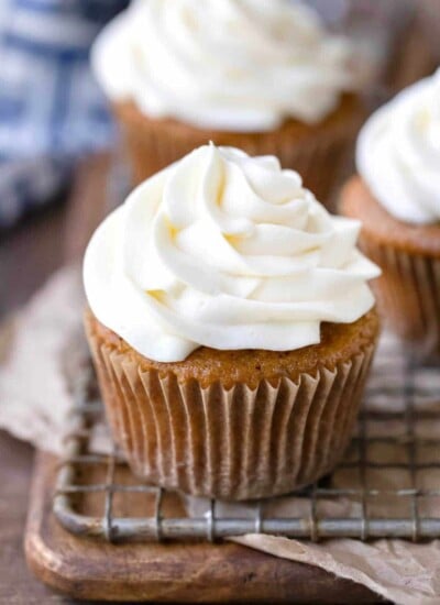 Cream cheese frosting on an apple spice cupcake.