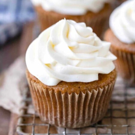 Cream cheese frosting on an apple spice cupcake.