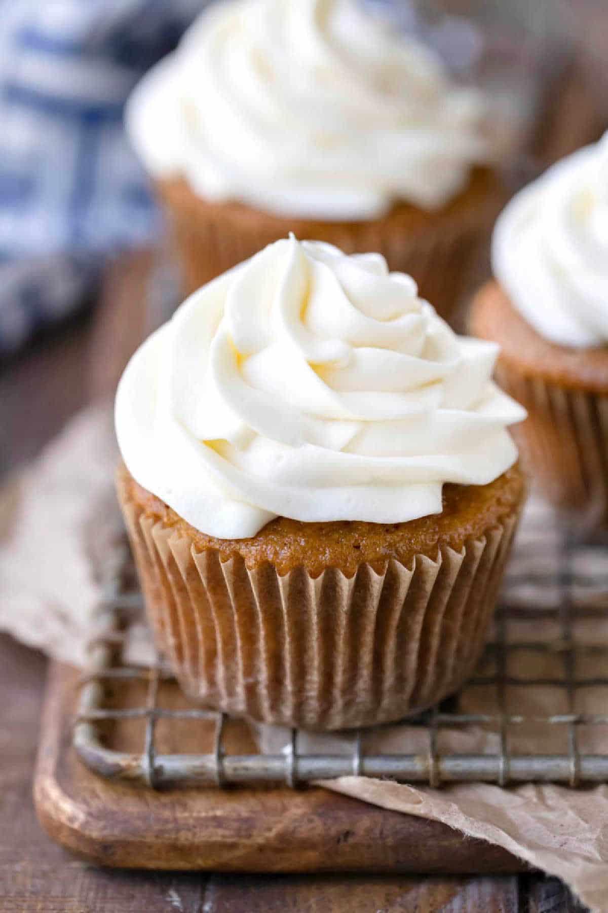 Cream cheese frosting on an apple spice cupcake.