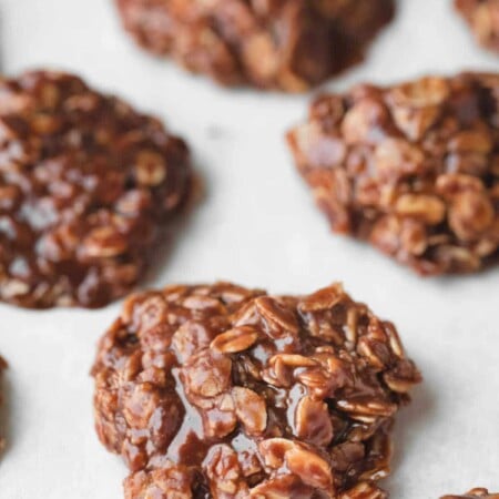 Rows of no bake cookies on parchment paper.