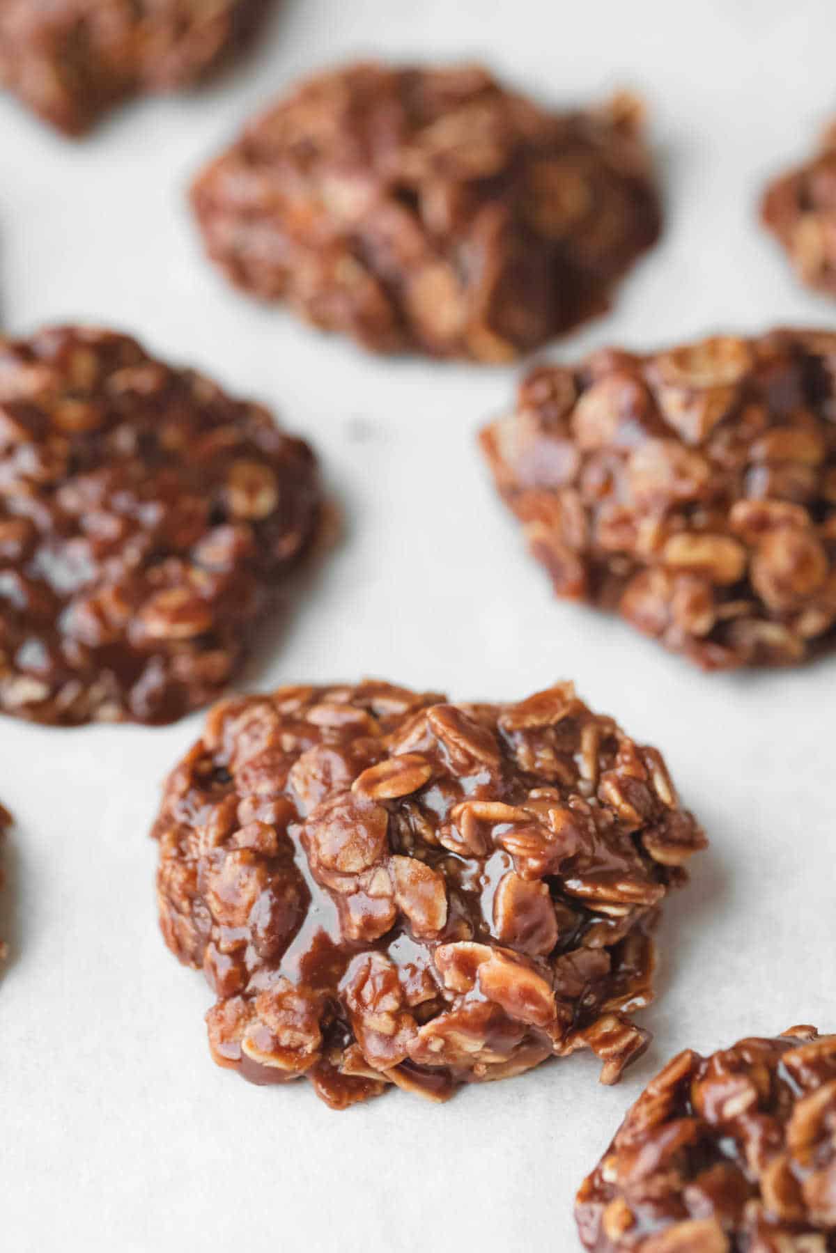 Rows of no bake cookies on parchment paper.