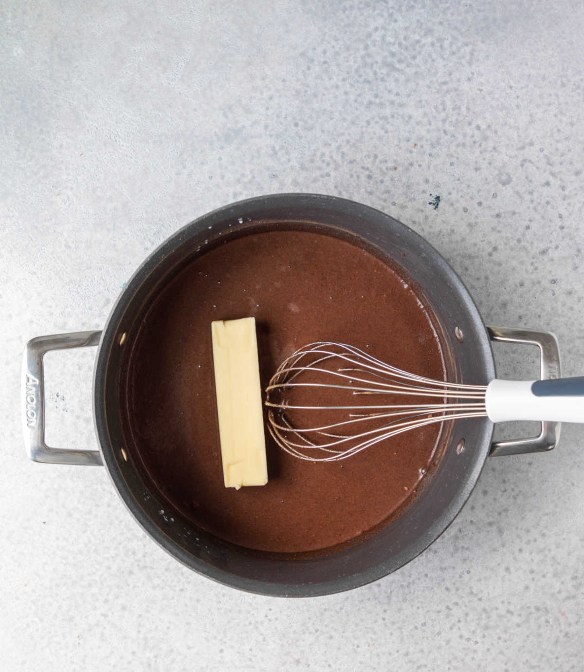 Butter and chocolate mixture in a saucepan.