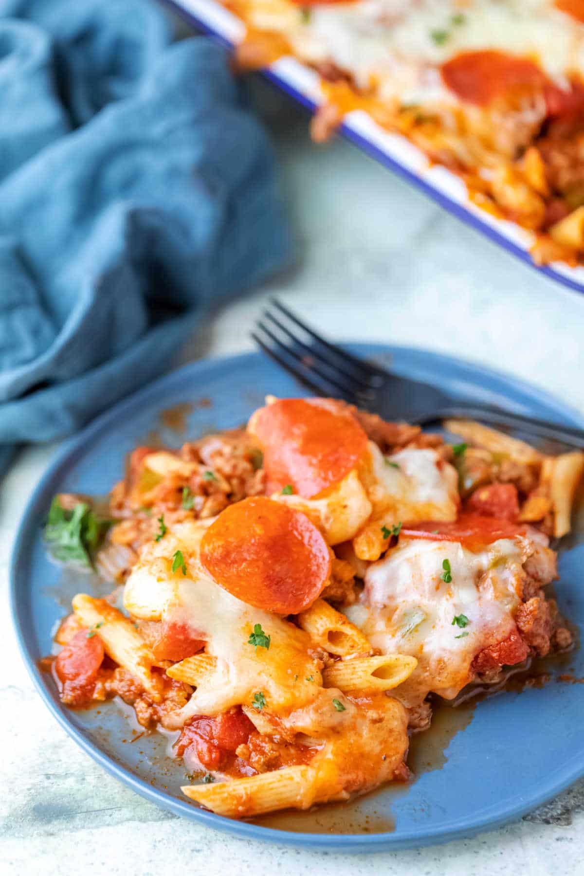 Pizza Pasta Recipe Pizza pasta on a blue plate.