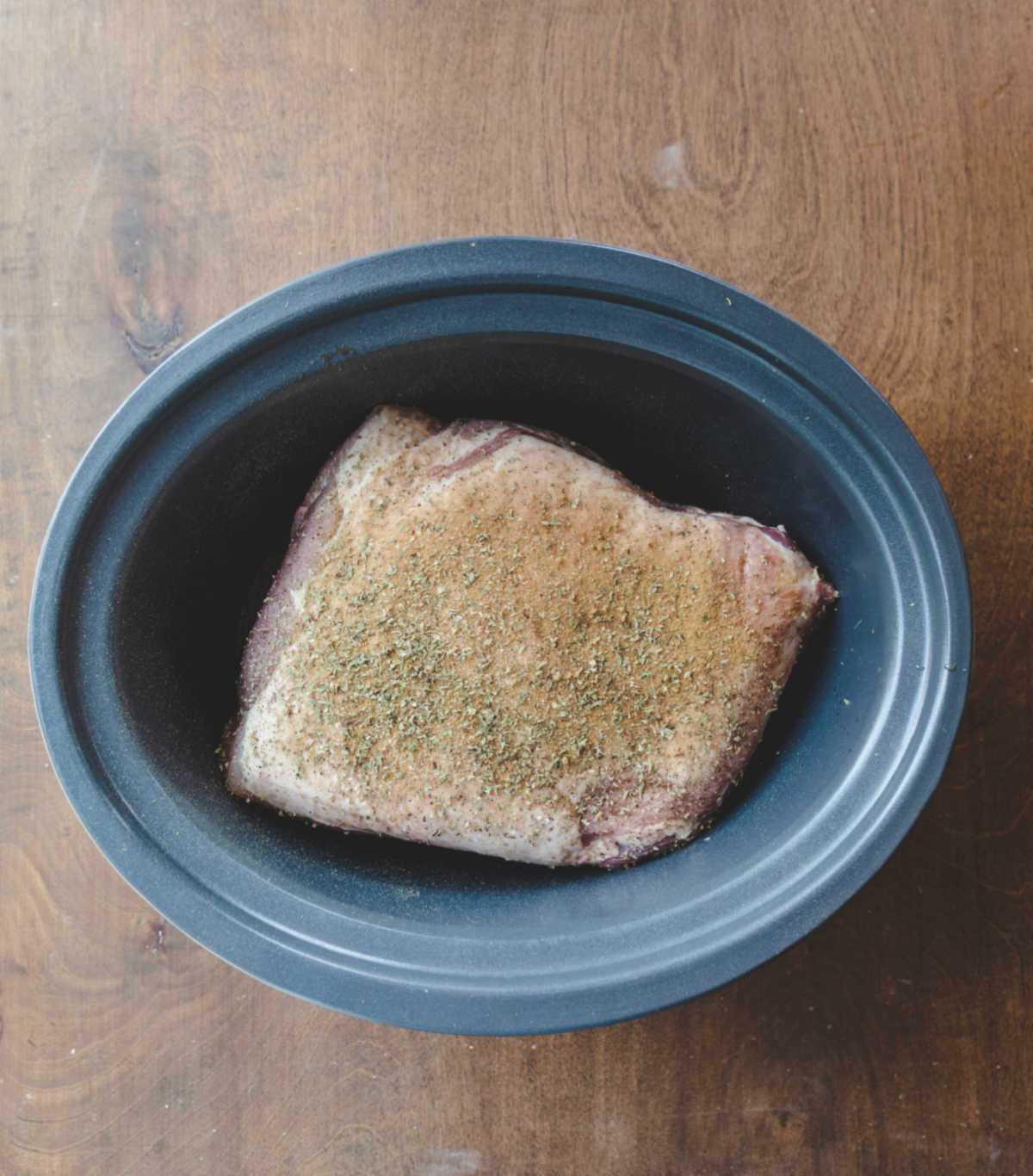 Pork roast sprinkled with cumin oregano salt and pepper. 