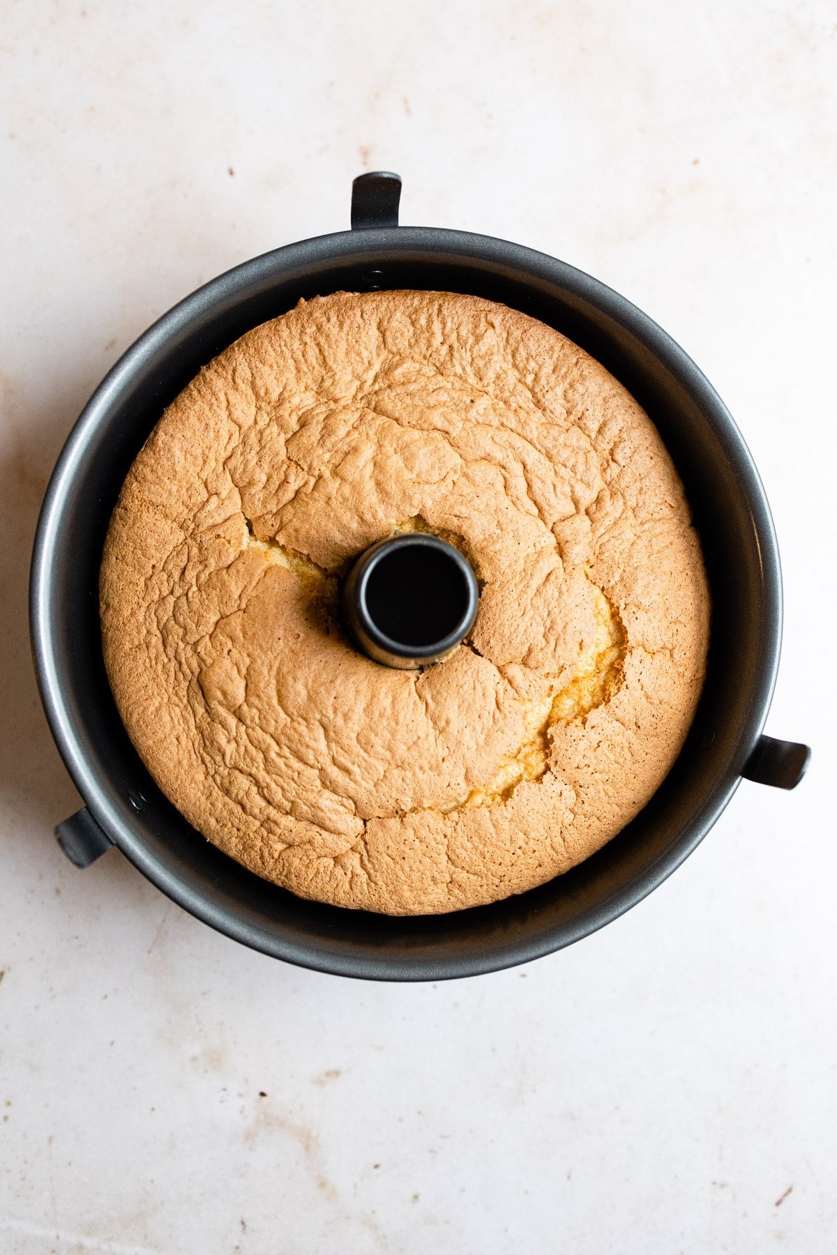 Baked sponge cake in a tube pan.