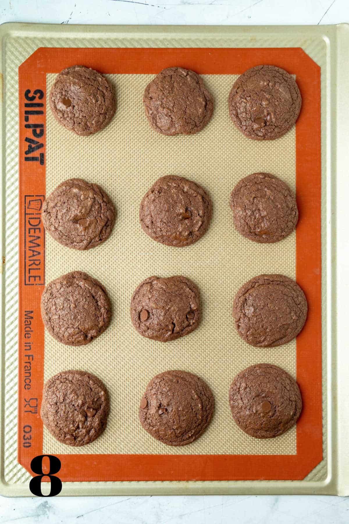 Baked Andes mint cookies on a baking sheet. 