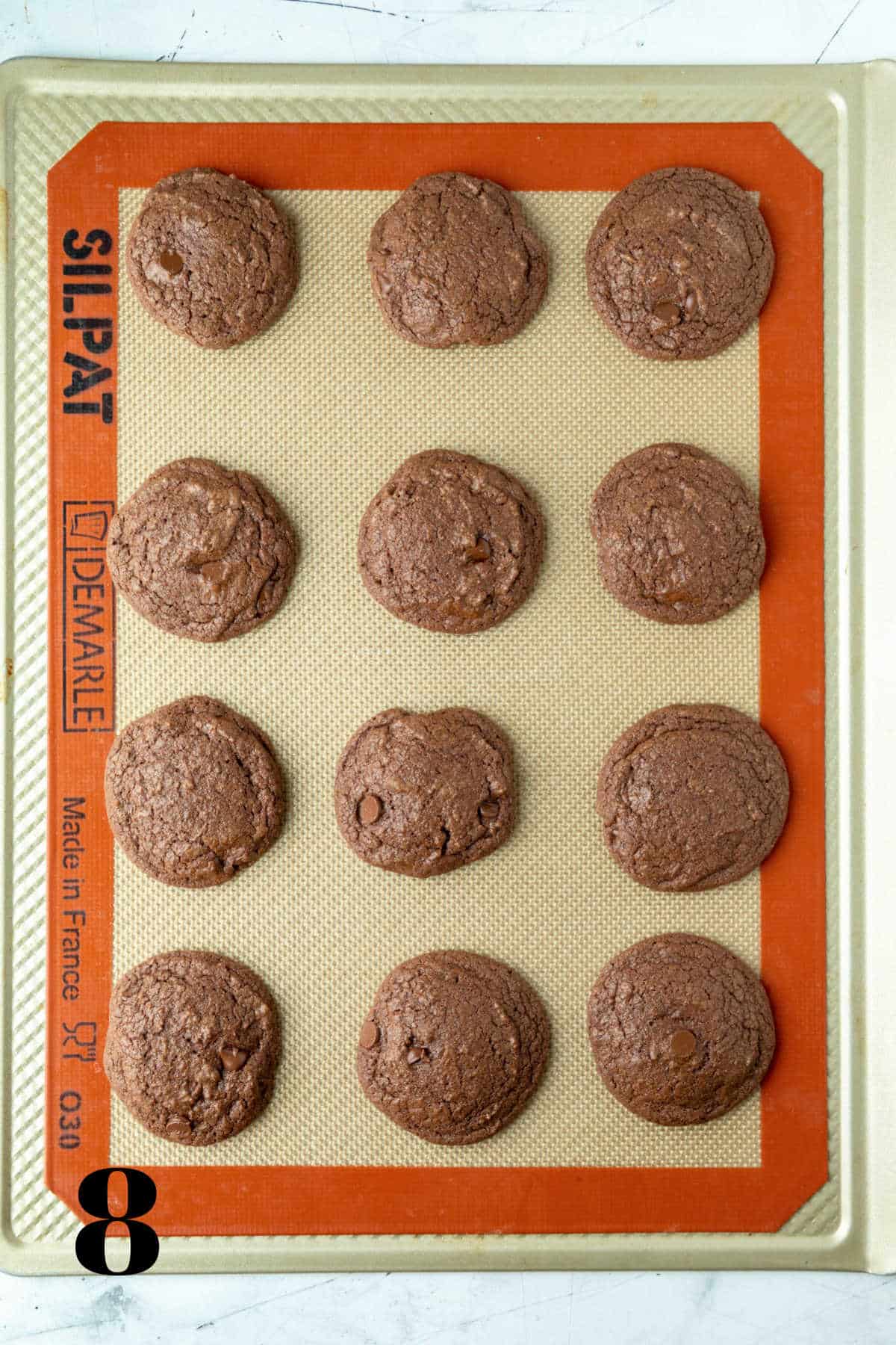 Baked Andes mint cookies on a baking sheet.