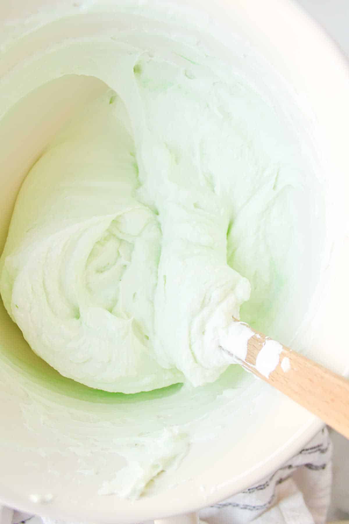 Whipped cream and marshmallow mixture in a mixing bowl. 