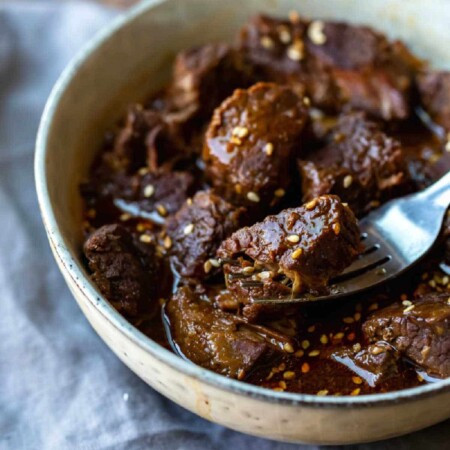 Instant Pot Korean Beef in a bowl with a fork