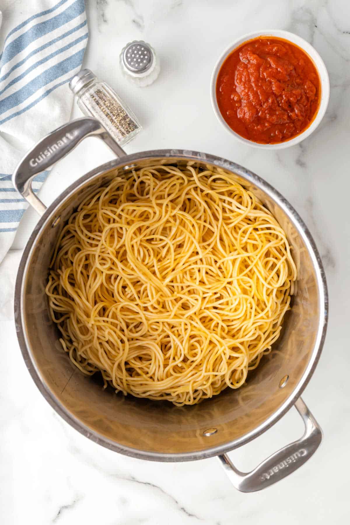 Cooked spaghetti noodles in a pot. 