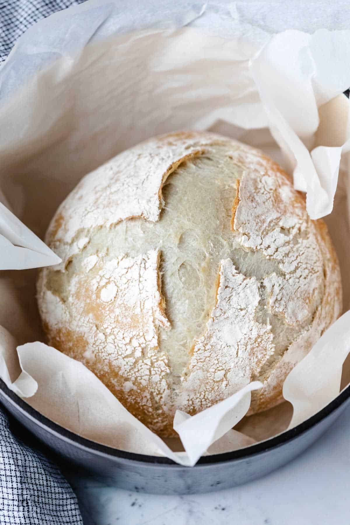 No knead bread in a blue Dutch oven.