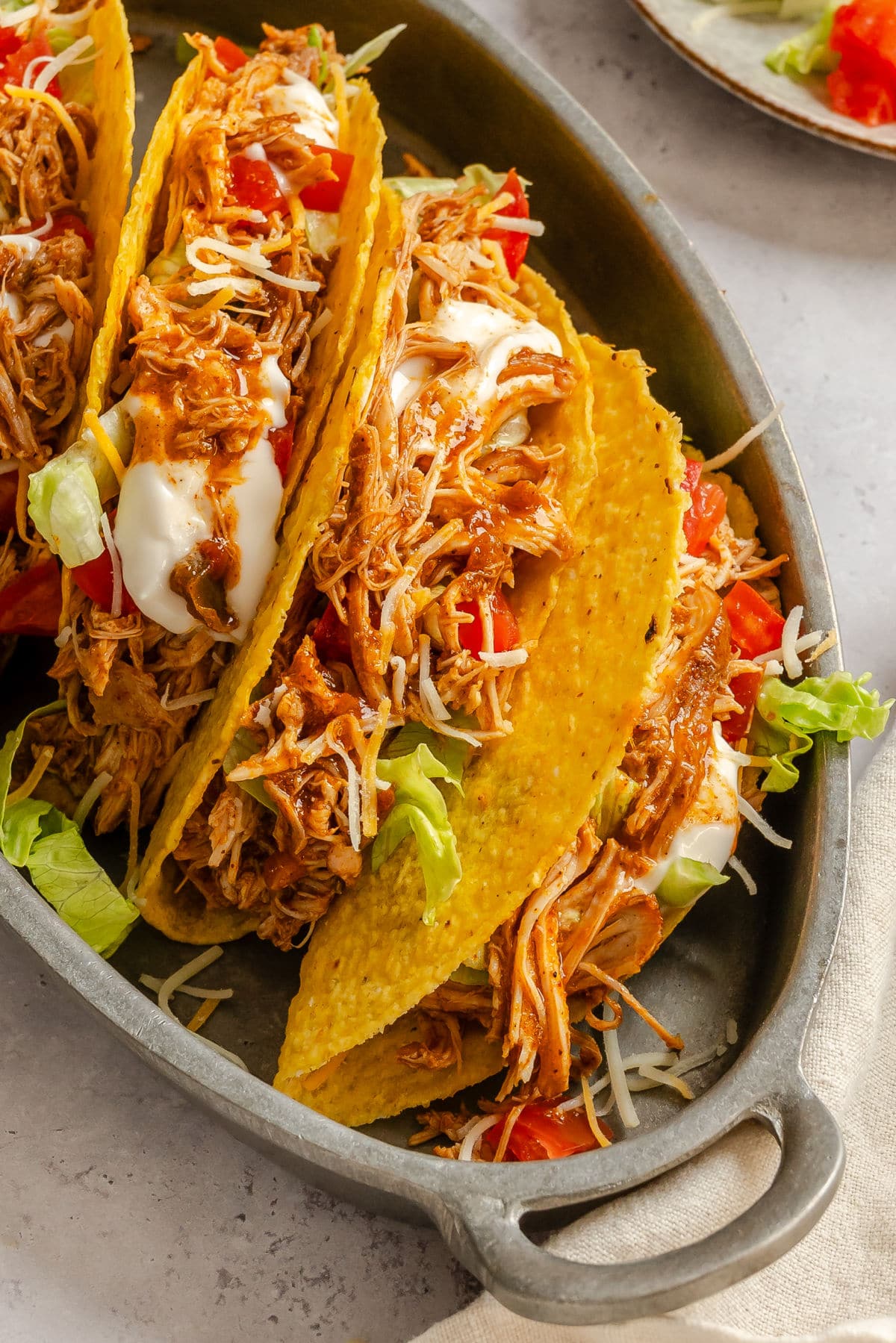 Chicken tacos on a serving platter.