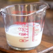 Buttermilk substitute in a glass measuring cup.