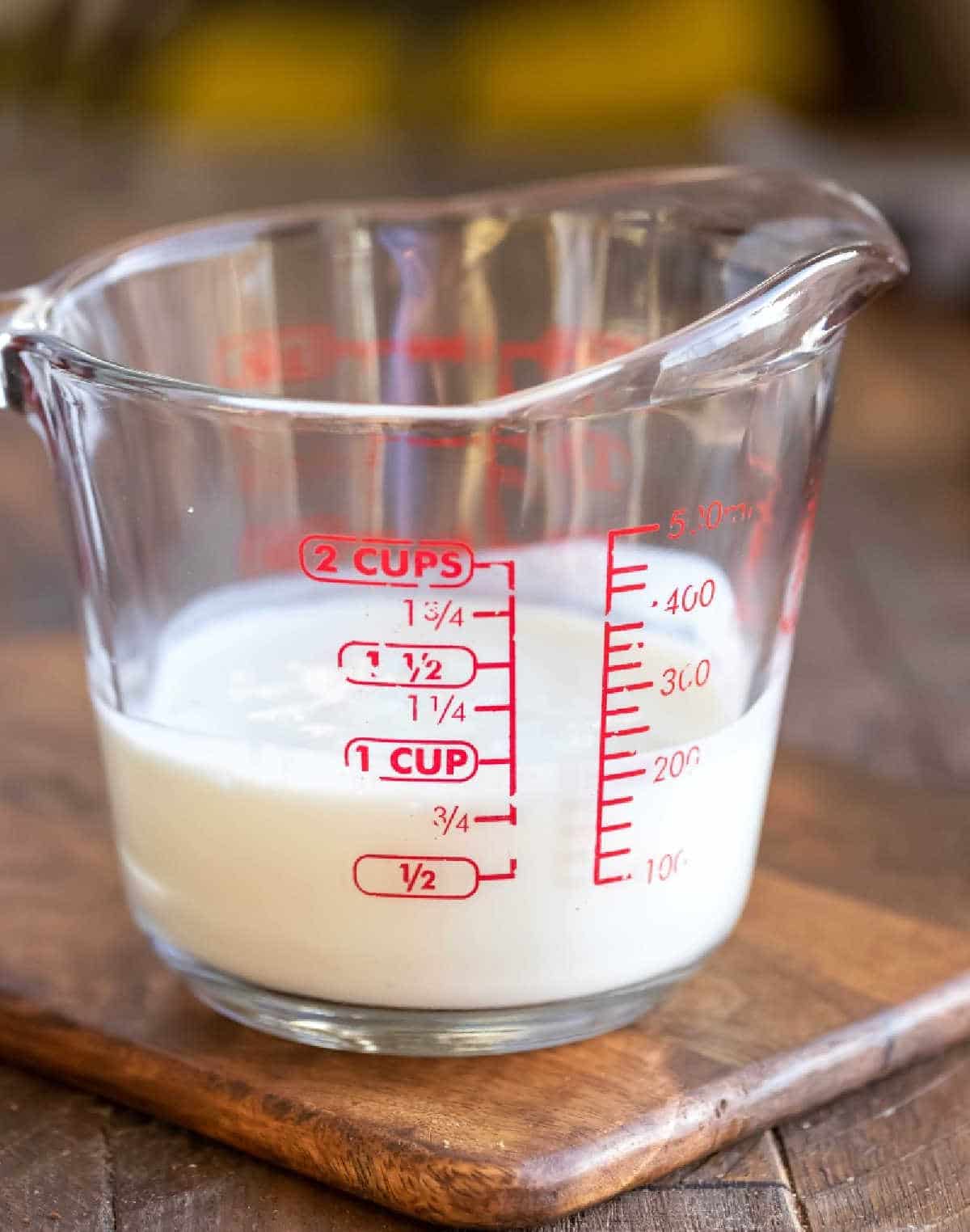 Buttermilk substitute in a glass measuring cup.