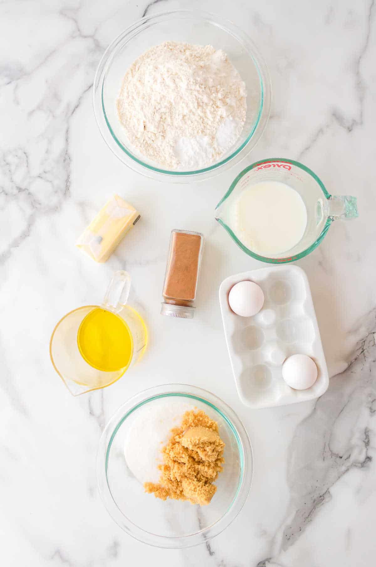 Ingredients for churro donuts in dishes. 
