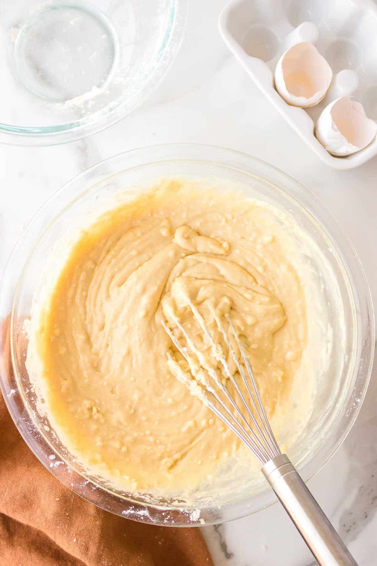 Churro donut batter in a mixing bowl. 