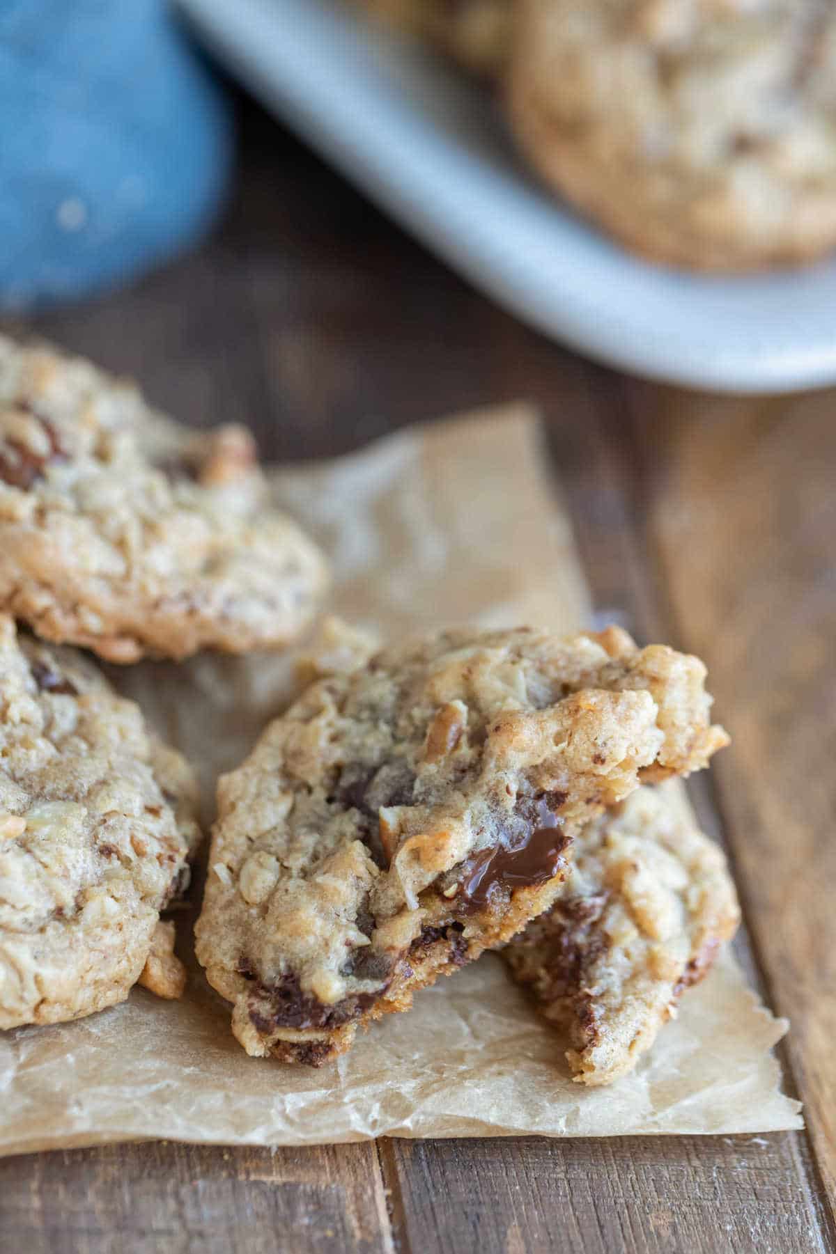 A cowboy cookie broken in half on top of each other. 