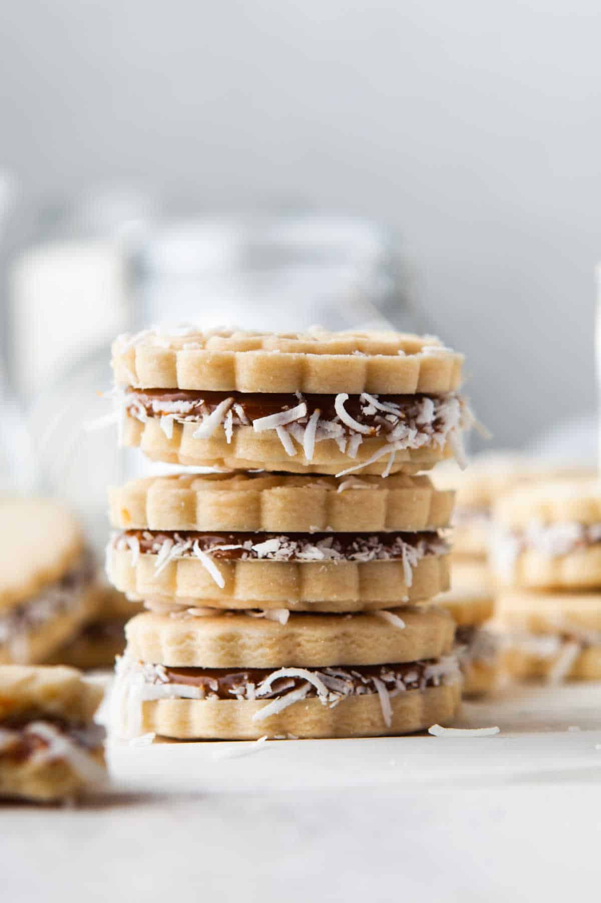 Three alfajores stacked on top of each other.
