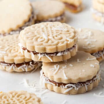 An alfajore stacked on top of two other alfajores.