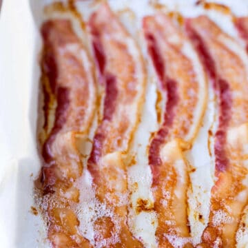 Baked bacon on a baking sheet.