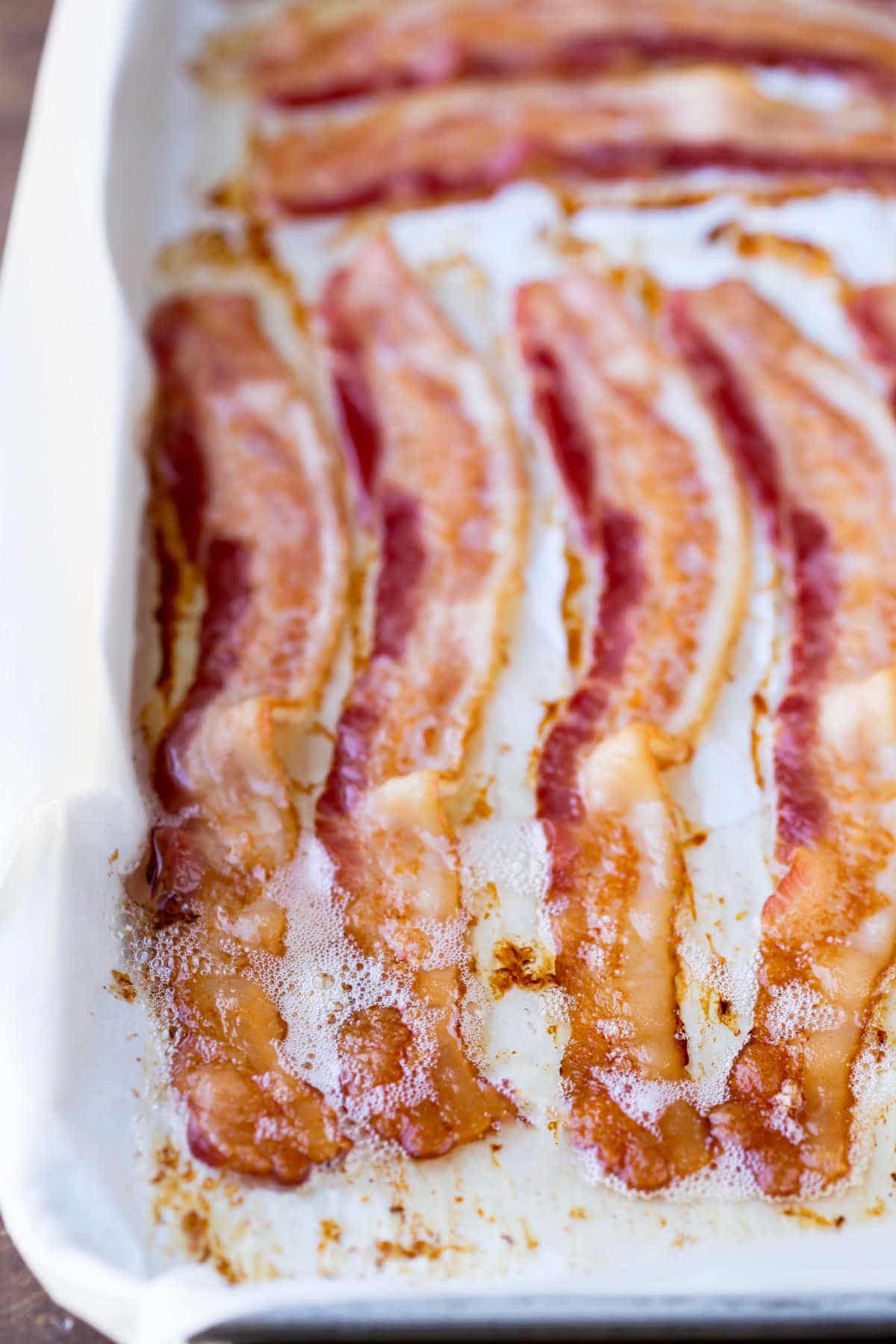 Baked bacon on a baking sheet.
