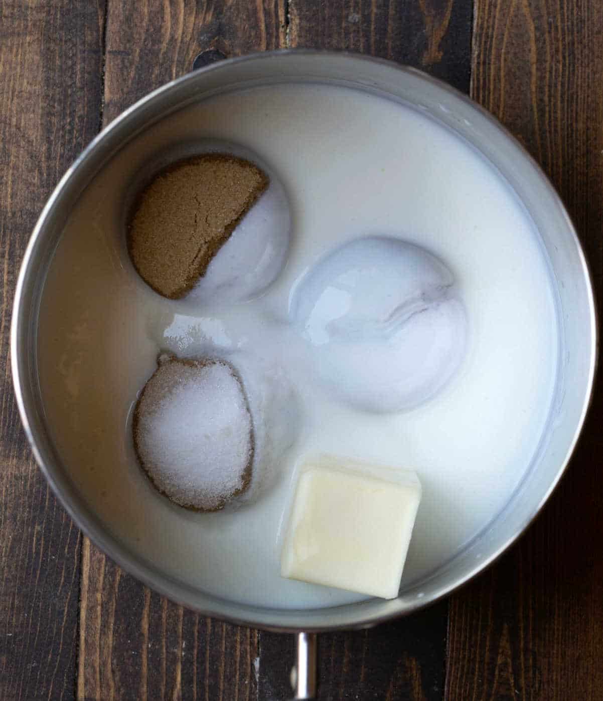 Butter sugars and buttermilk in a saucepan.