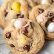 Cadbury mini egg cookies on a scalloped plate.