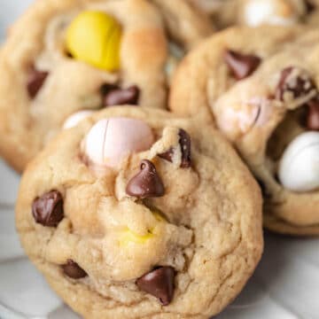 Cadbury mini egg cookies on a scalloped plate.