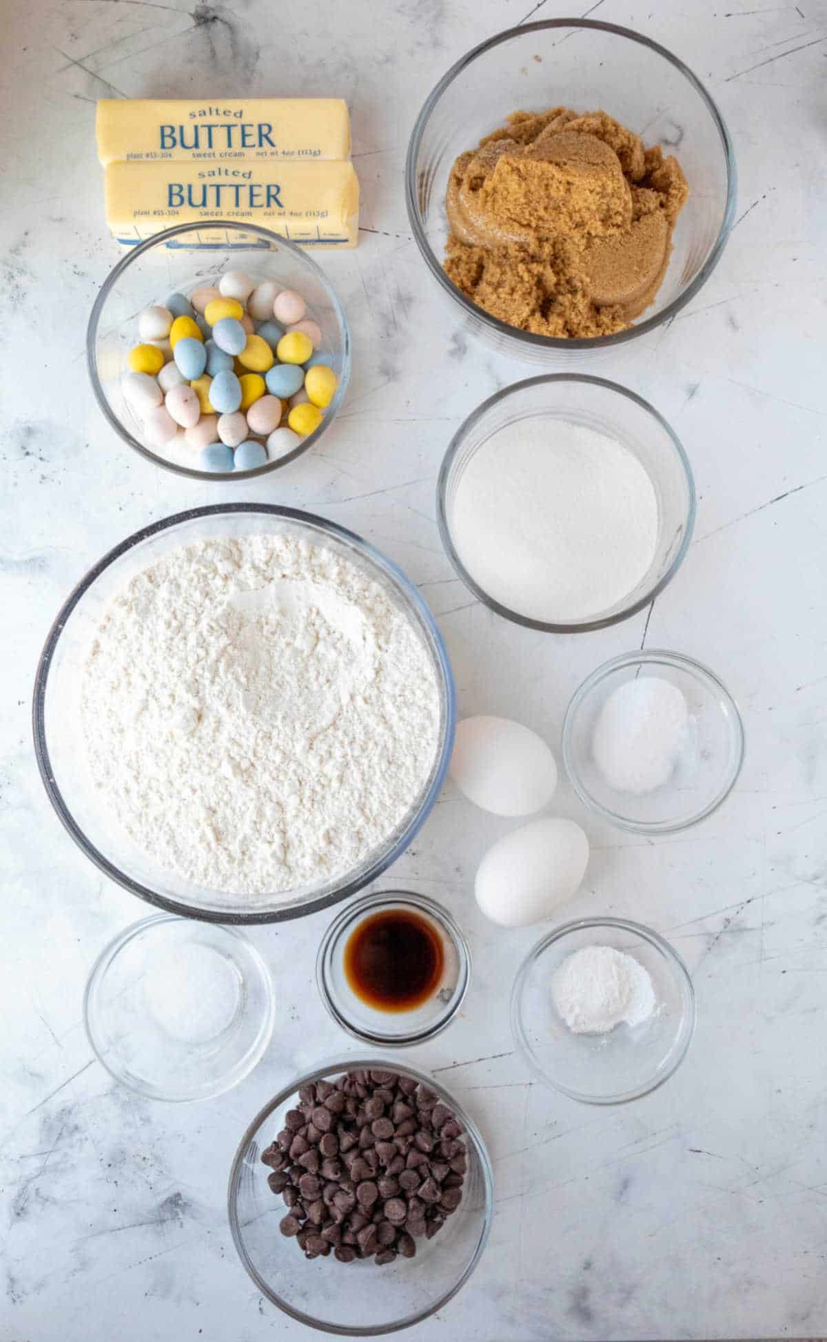 Ingredients for cadbury mini egg cookies in dishes. 