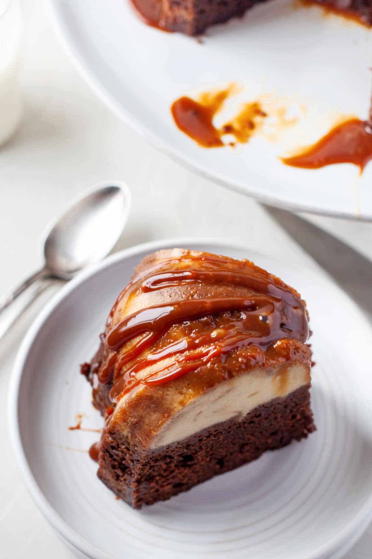 A slice of chocoflan on a white plate. 