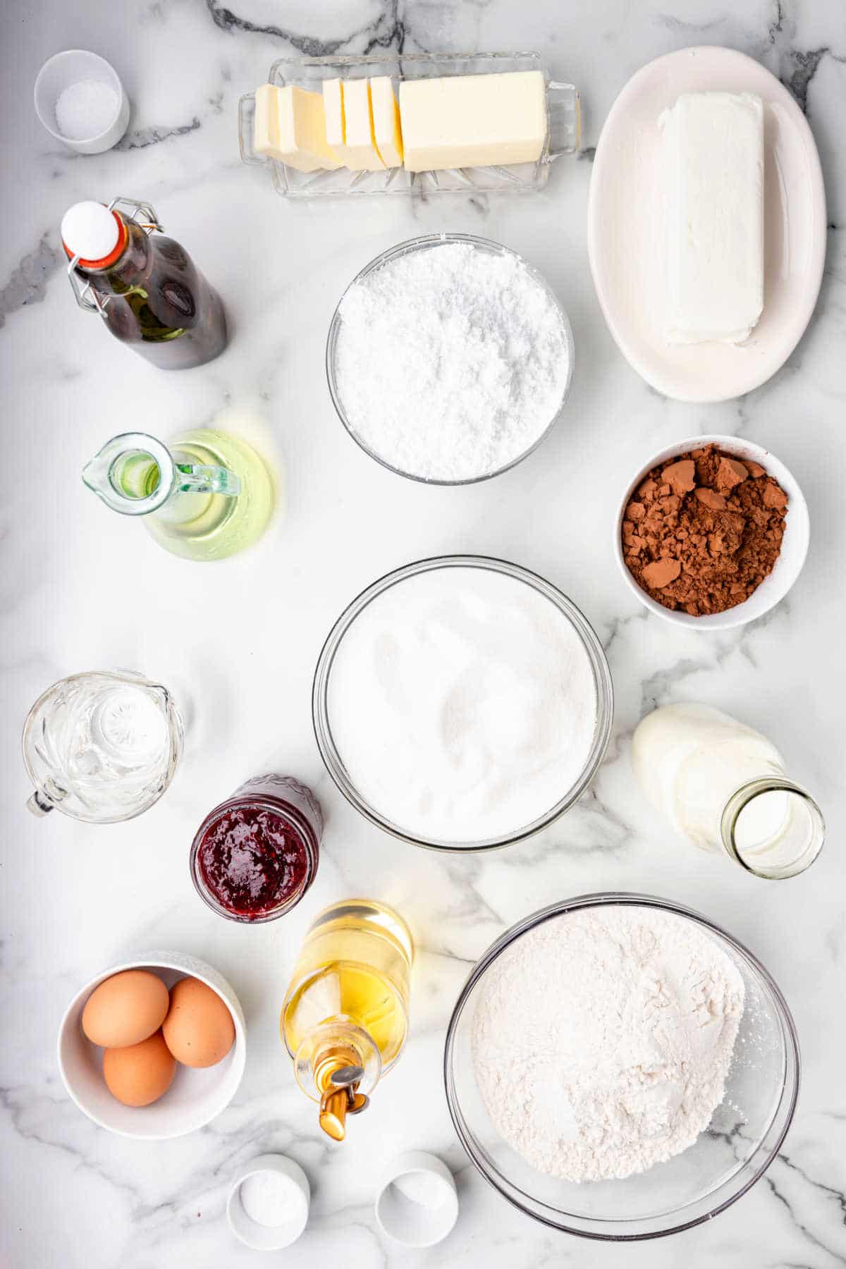 Ingredients for chocolate raspberry cake in dishes.
