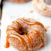 Churro donut topped with caramel.