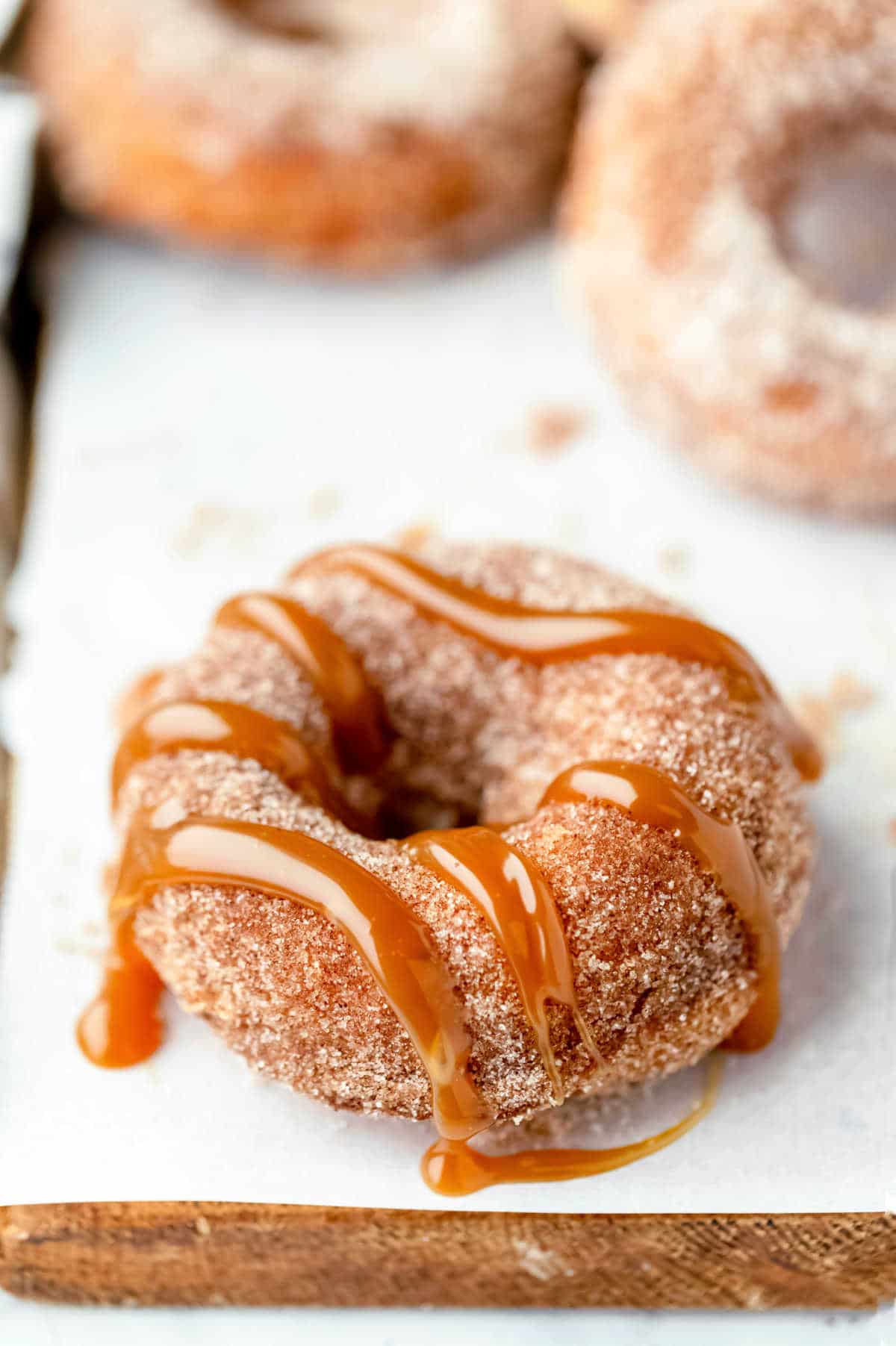 Churro donut topped with caramel.