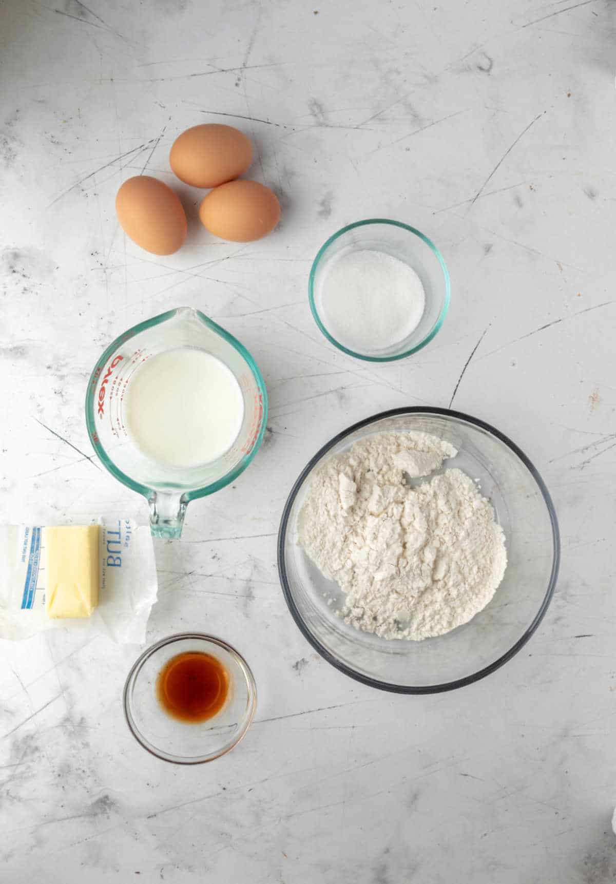 Ingredients for German pancakes in dishes.