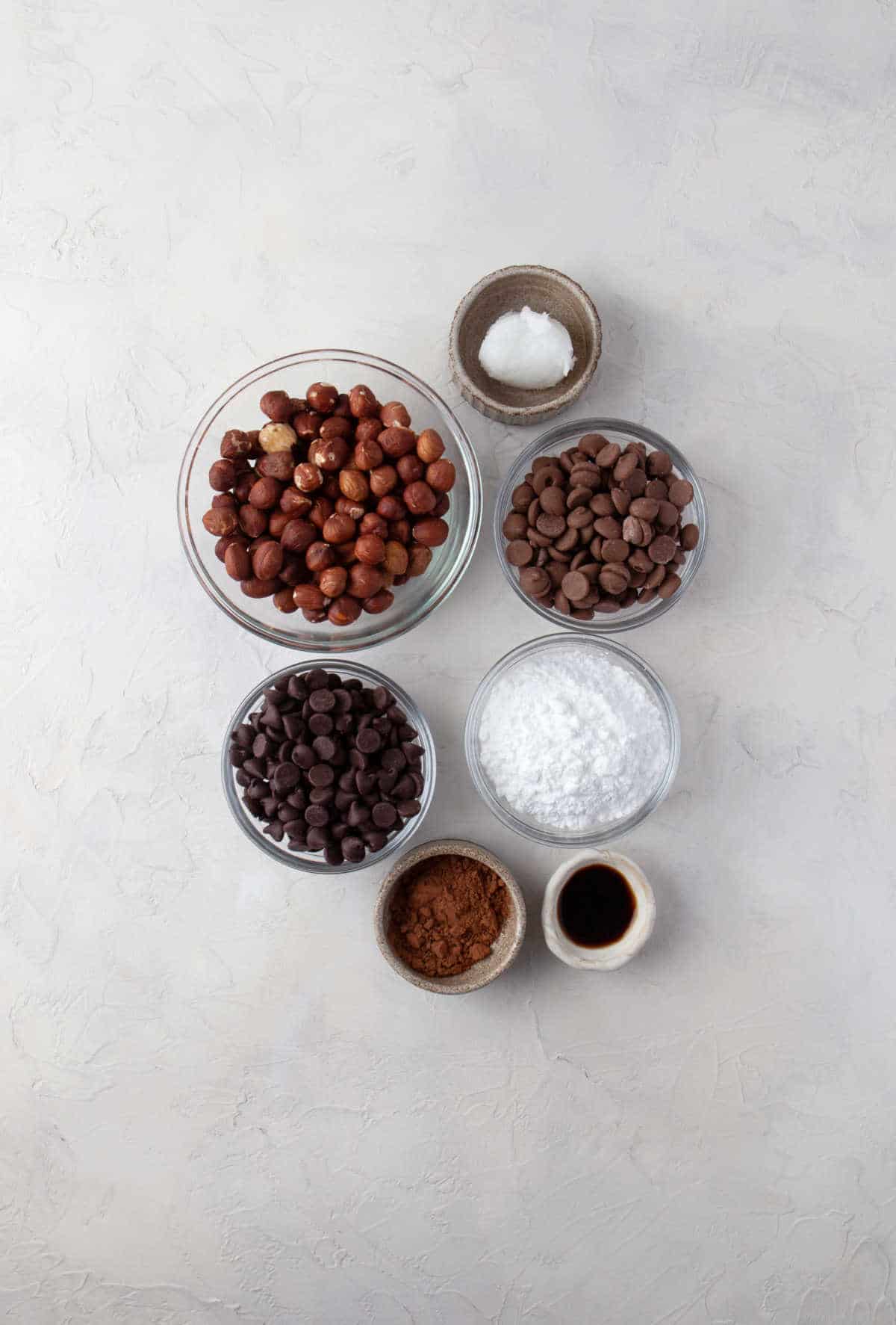 Ingredients for homemade nutella in dishes. 
