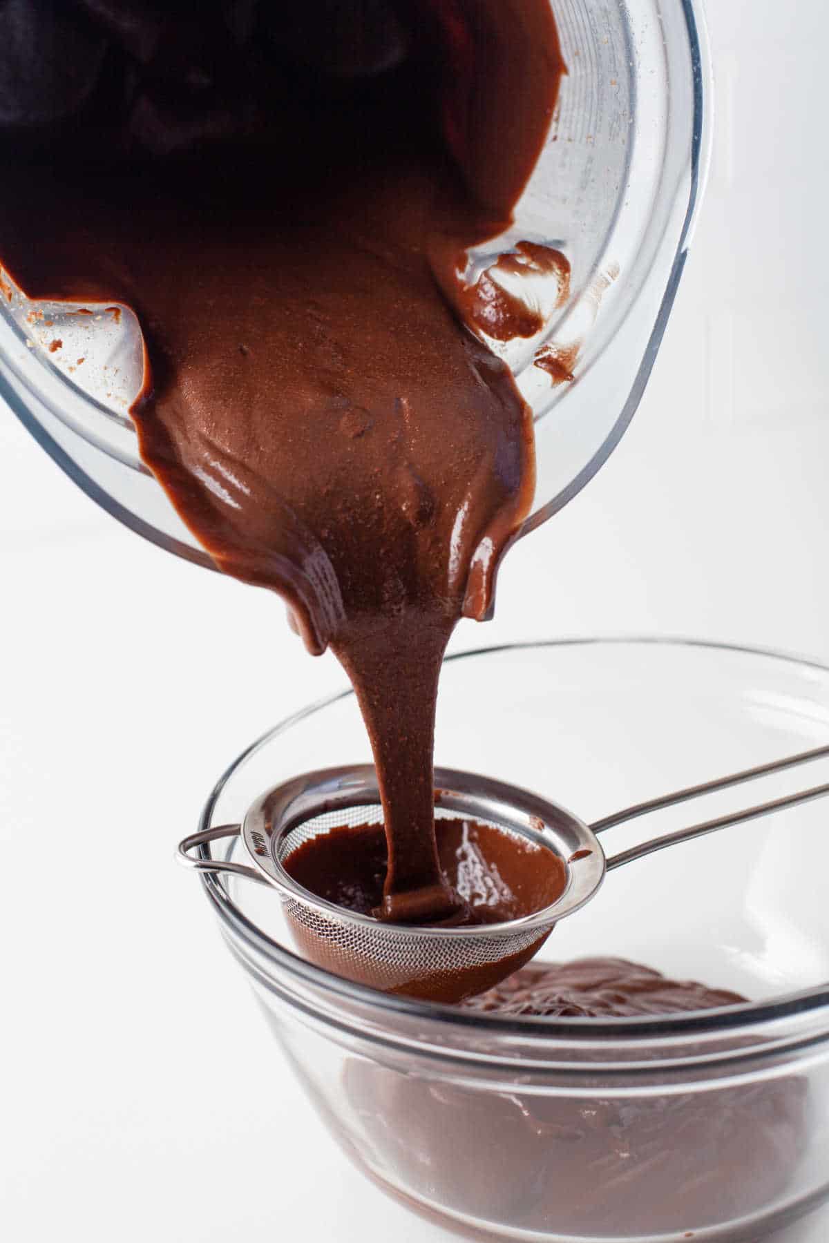 Nutella pouring through a fine mesh strainer. 