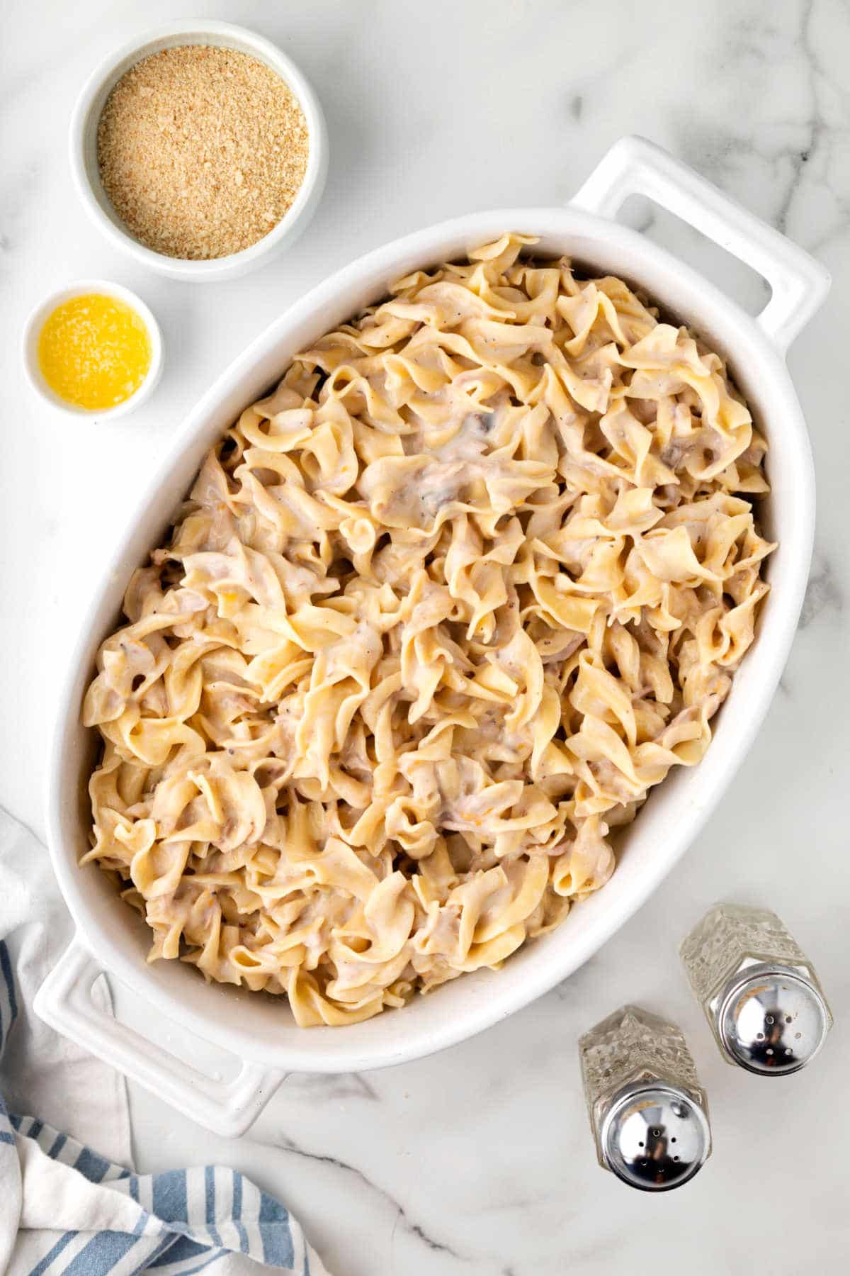 Uncooked tuna noodle casserole in a baking dish. 