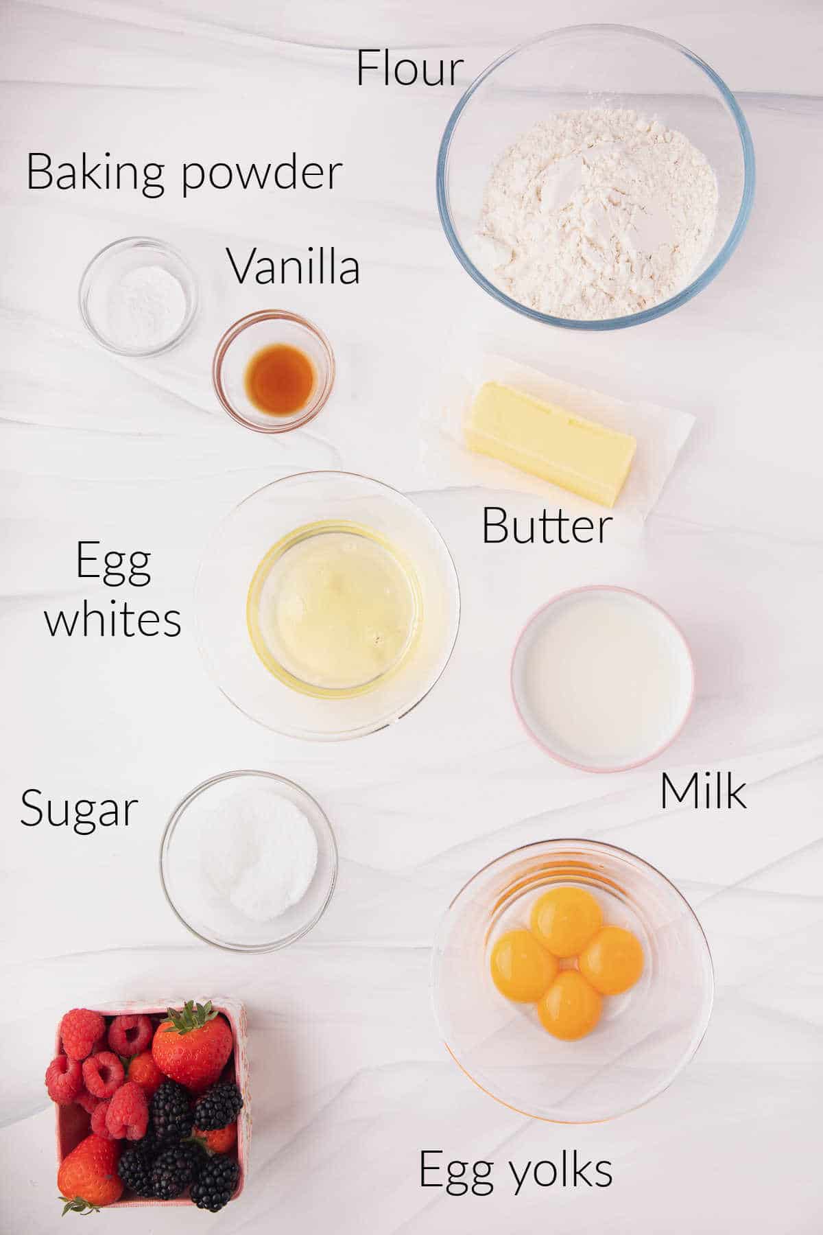 Ingredients for Belgian waffles in dishes with labels on them.