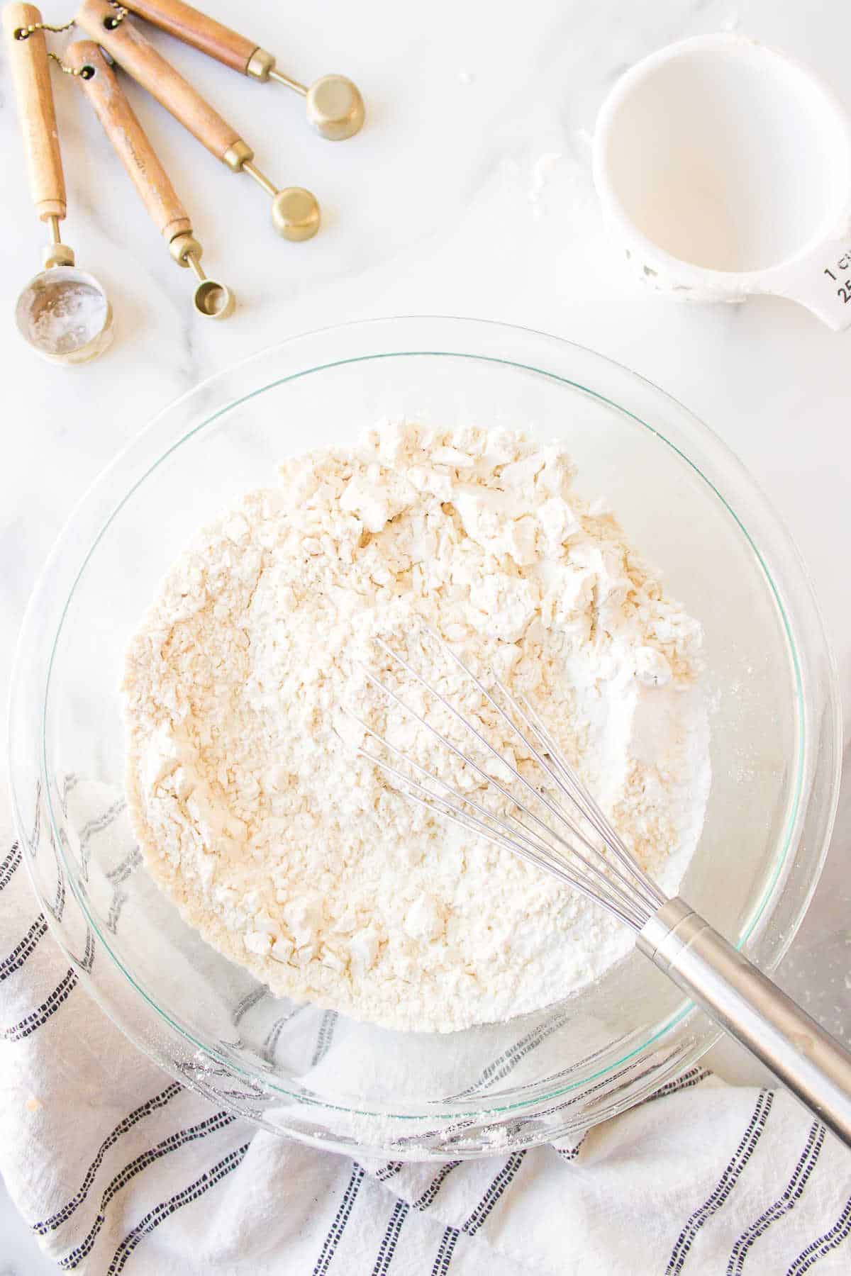 Flour baking powder and salt in a mixing bowl.