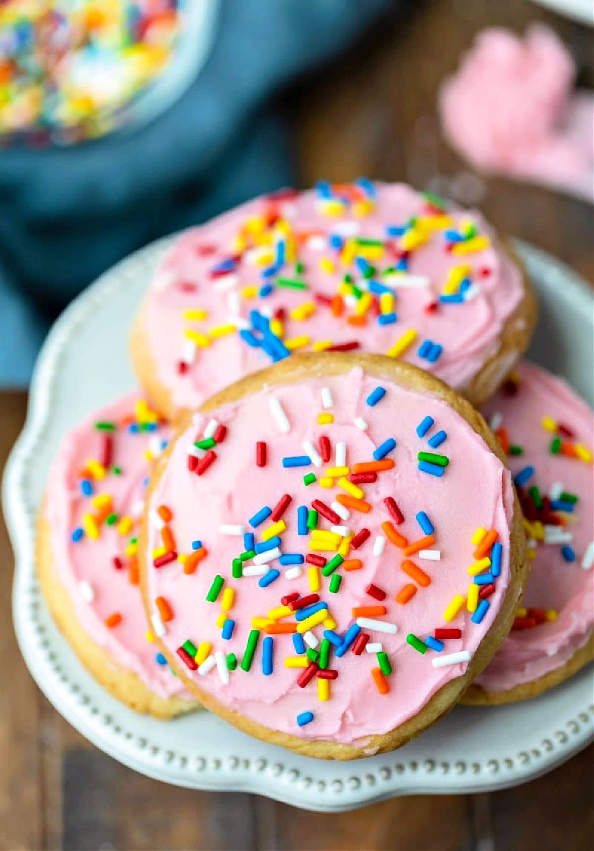 Stack of lofthouse cookies on a cake plate.