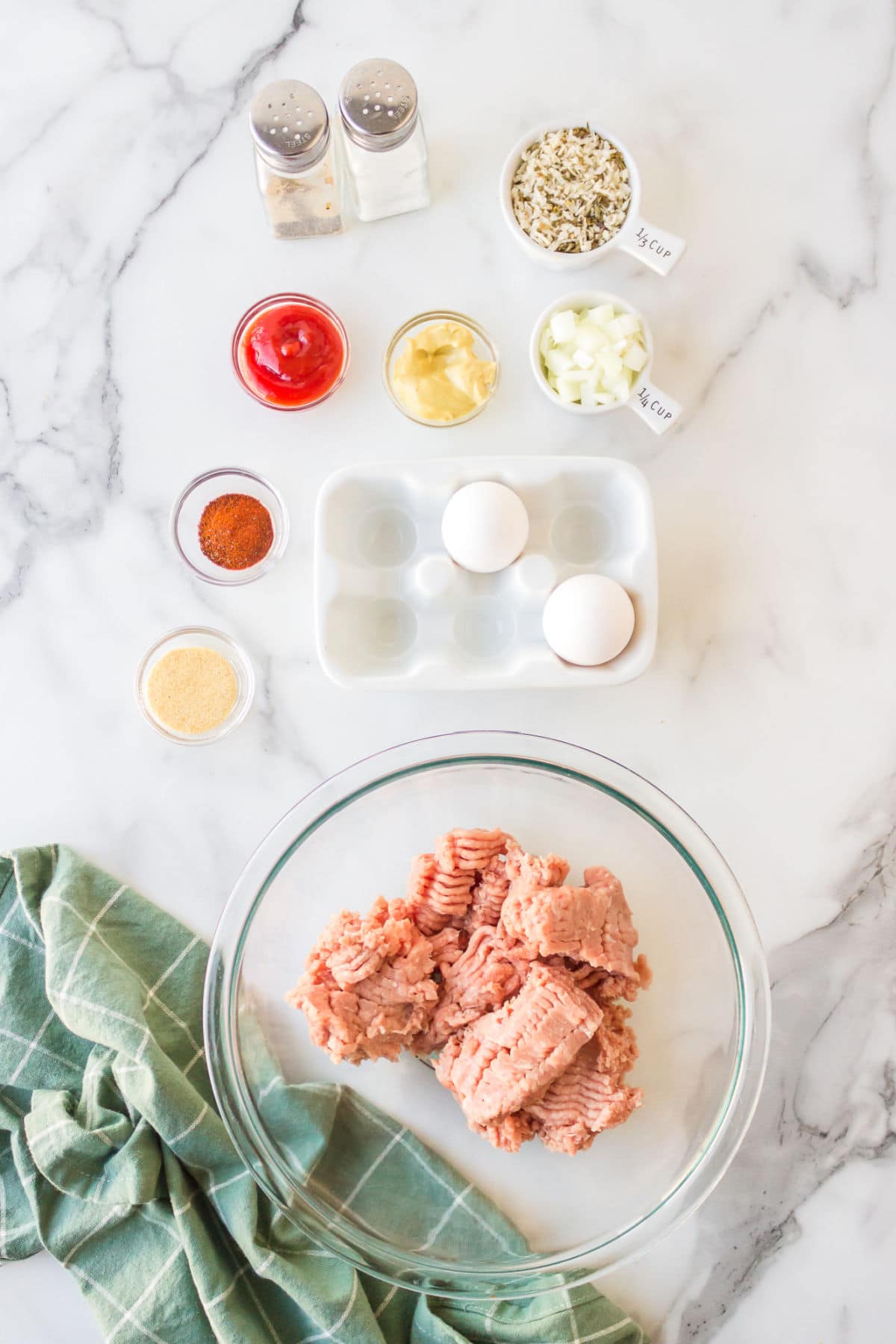 Ingredients for turkey burgers in dishes. 