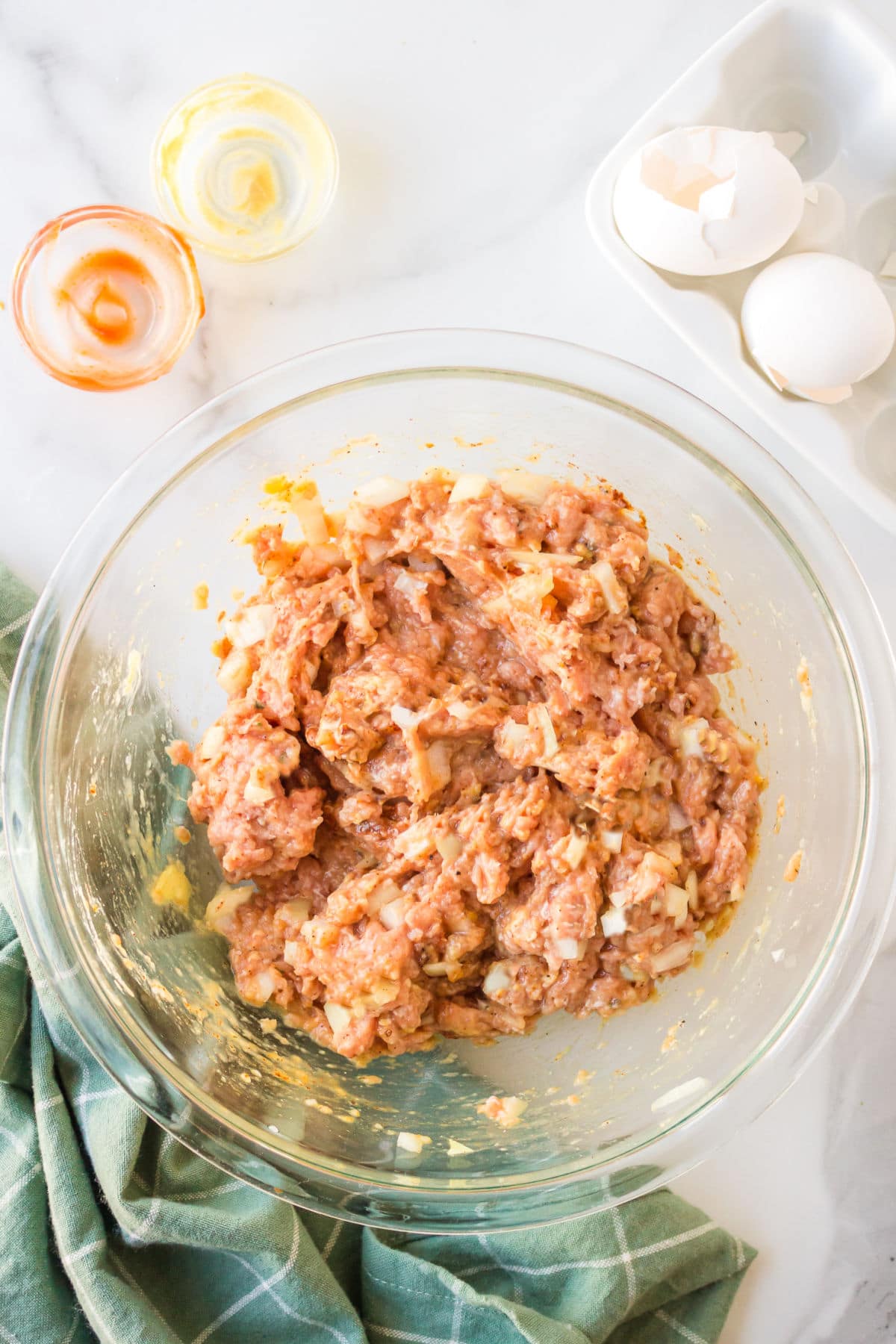 Ground turkey mixture in a mixing bowl. 